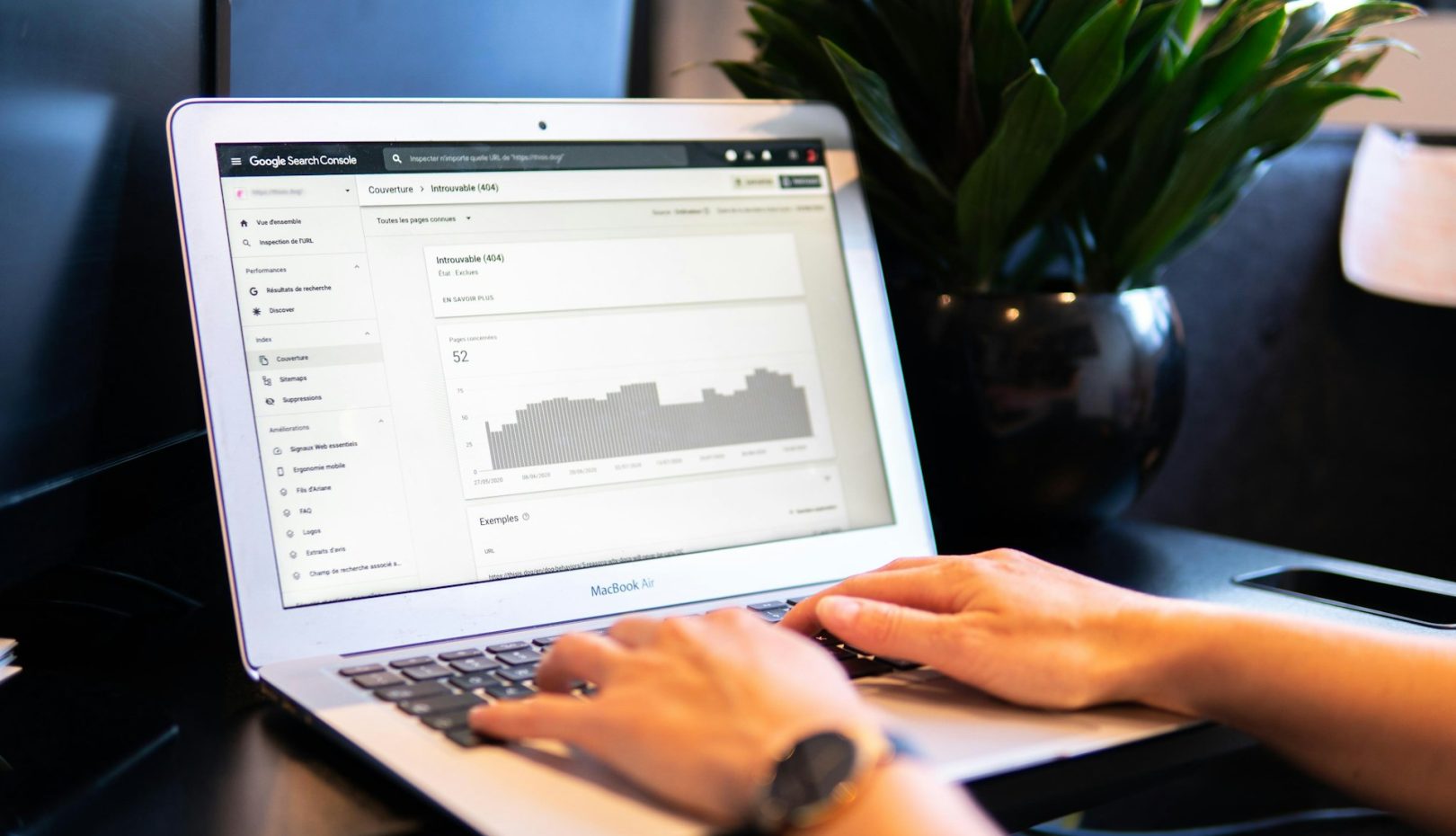 Person using a laptop to search for 2024 digital marketing trends, with search results displaying keywords like personalization, voice search, AR, metaverse, and ethical data practices.